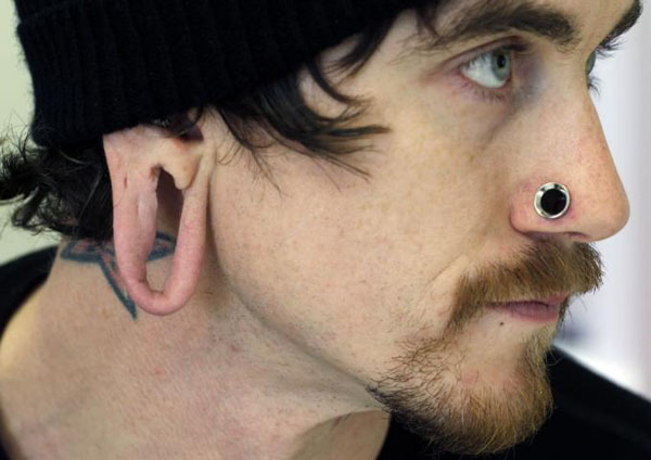 Men with stretched-out earlobes are getting surgery because they can't get jobs!