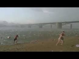 Watch: Hail Storm On The Beach...OUCH.